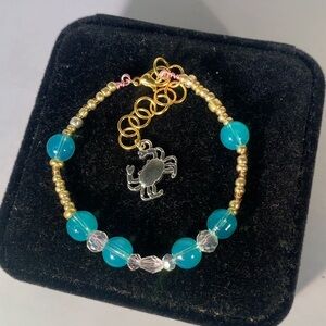 SEA GLASS ORBIT — Handcrafted Aquamarine & Gold Glass Bead Bracelet w Crab Charm